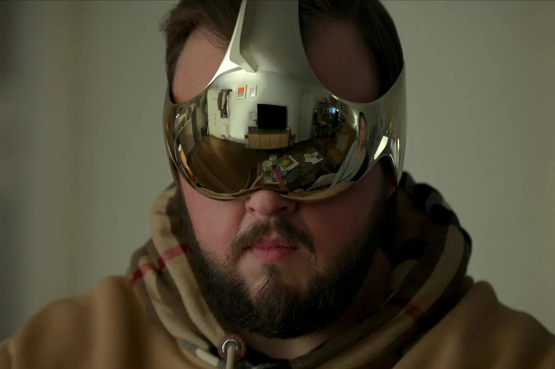 Screenshot of bearded man wearing futuristic metallic headset from the Netflix TV show 3 Body Problem