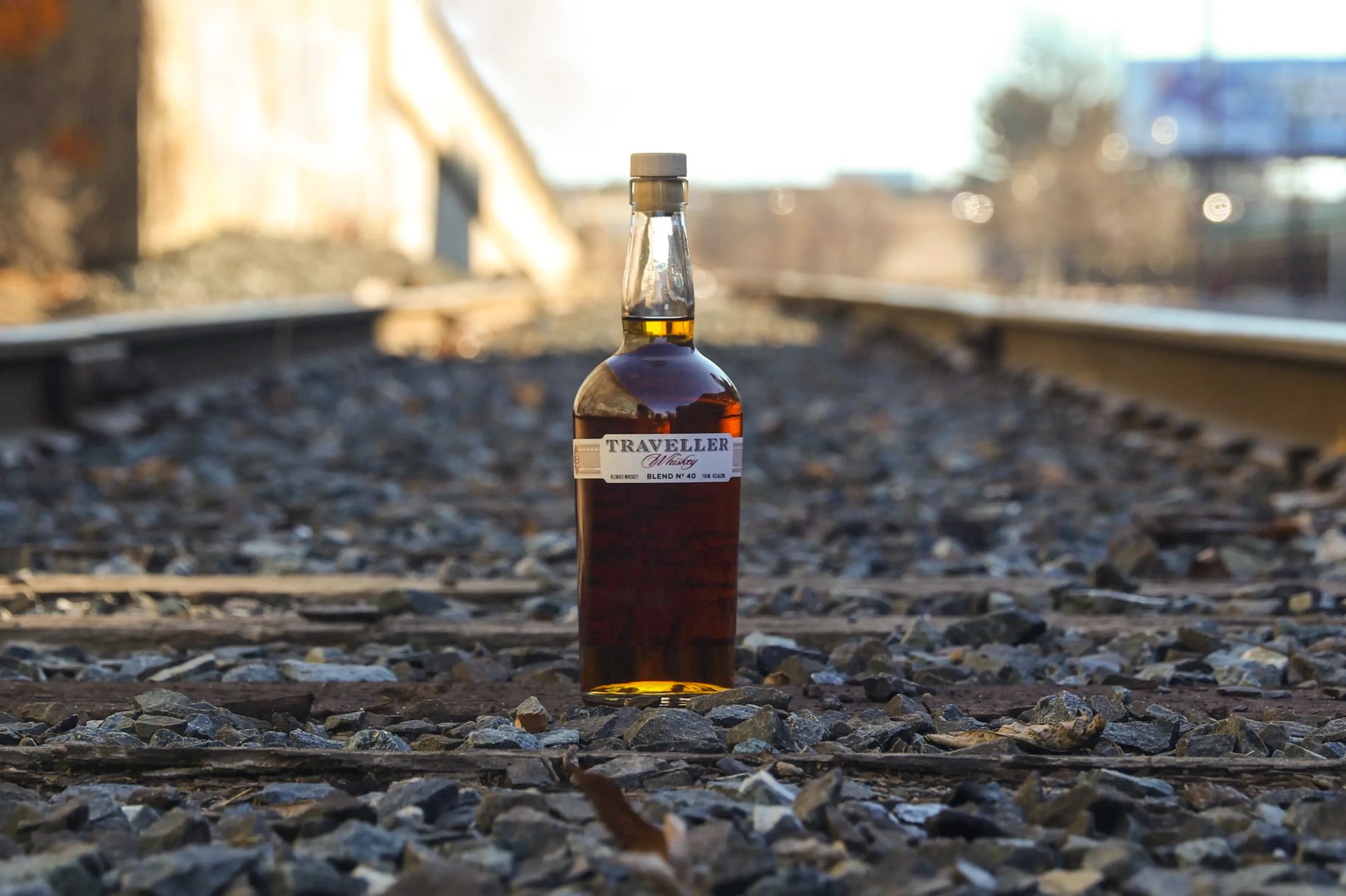 whiskey bottle on traintracks