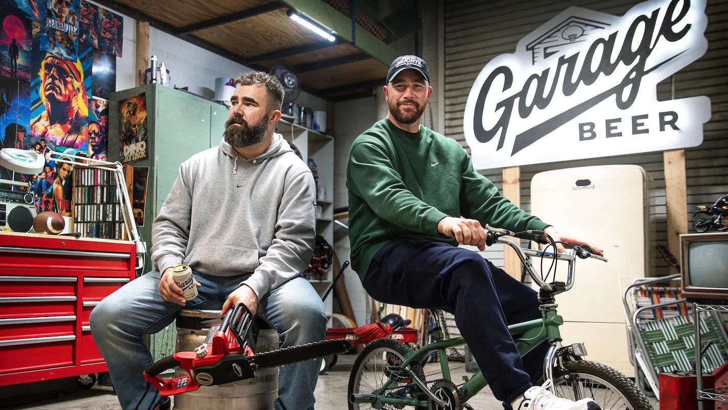 jason and travis kelce in a garage