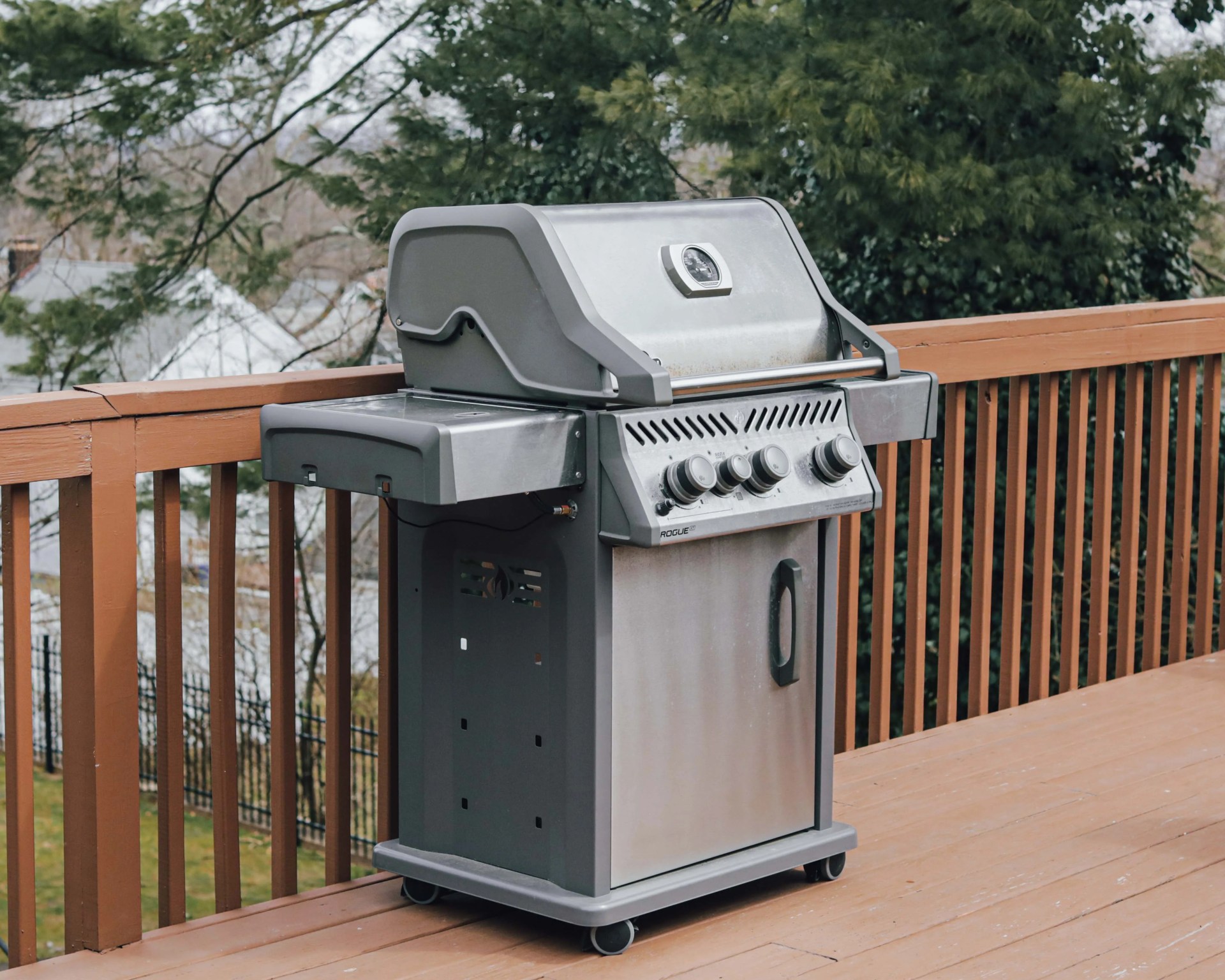 gas grill on a wooden deck