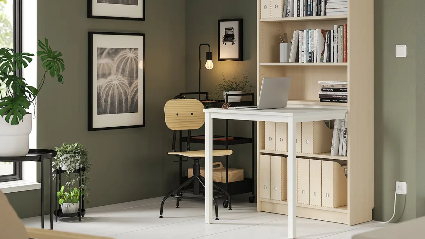 home office featuring ikea furniture including a desk attached to a bookcase