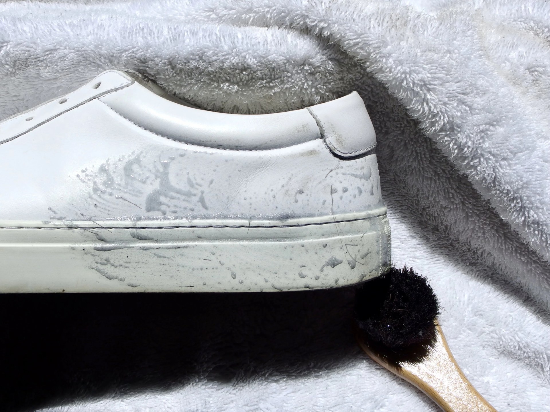 leather sneakers being cleaned