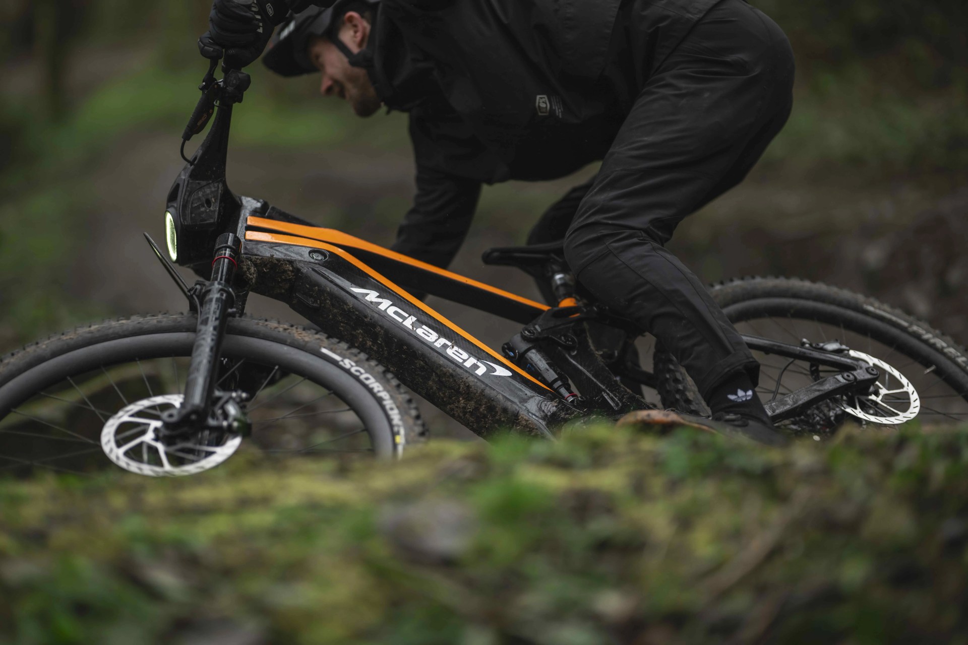 man rides a mclaren mountain bike on a trail