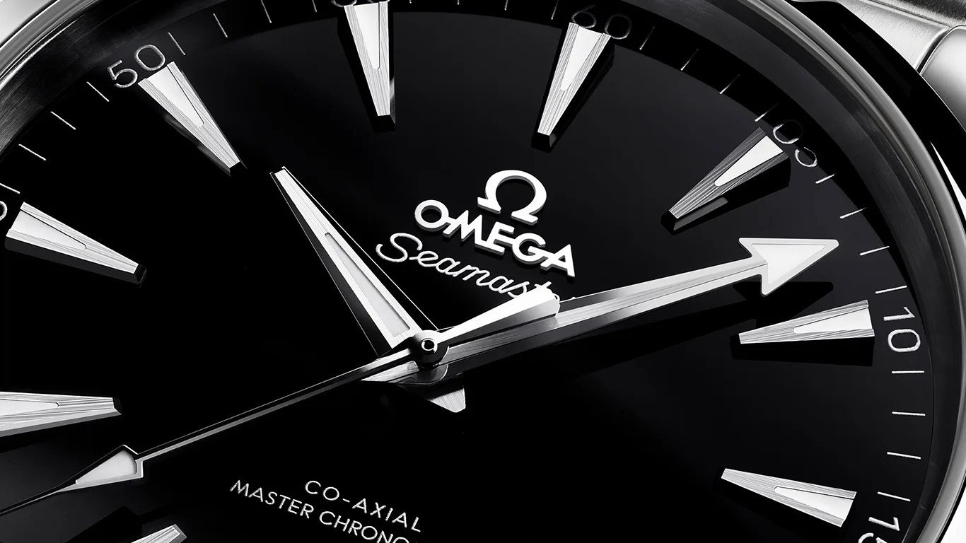 closeup of black omega watch dial