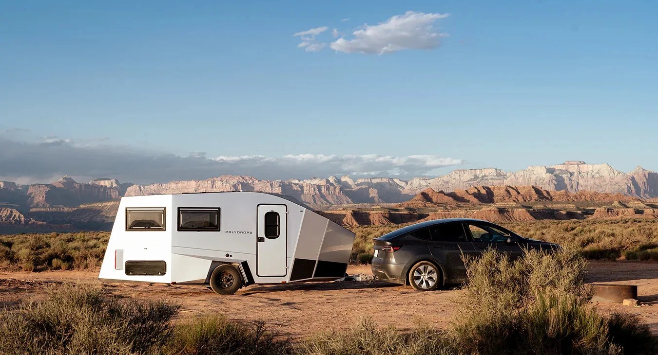 polydrops trailer towed behind a tesla in the desert