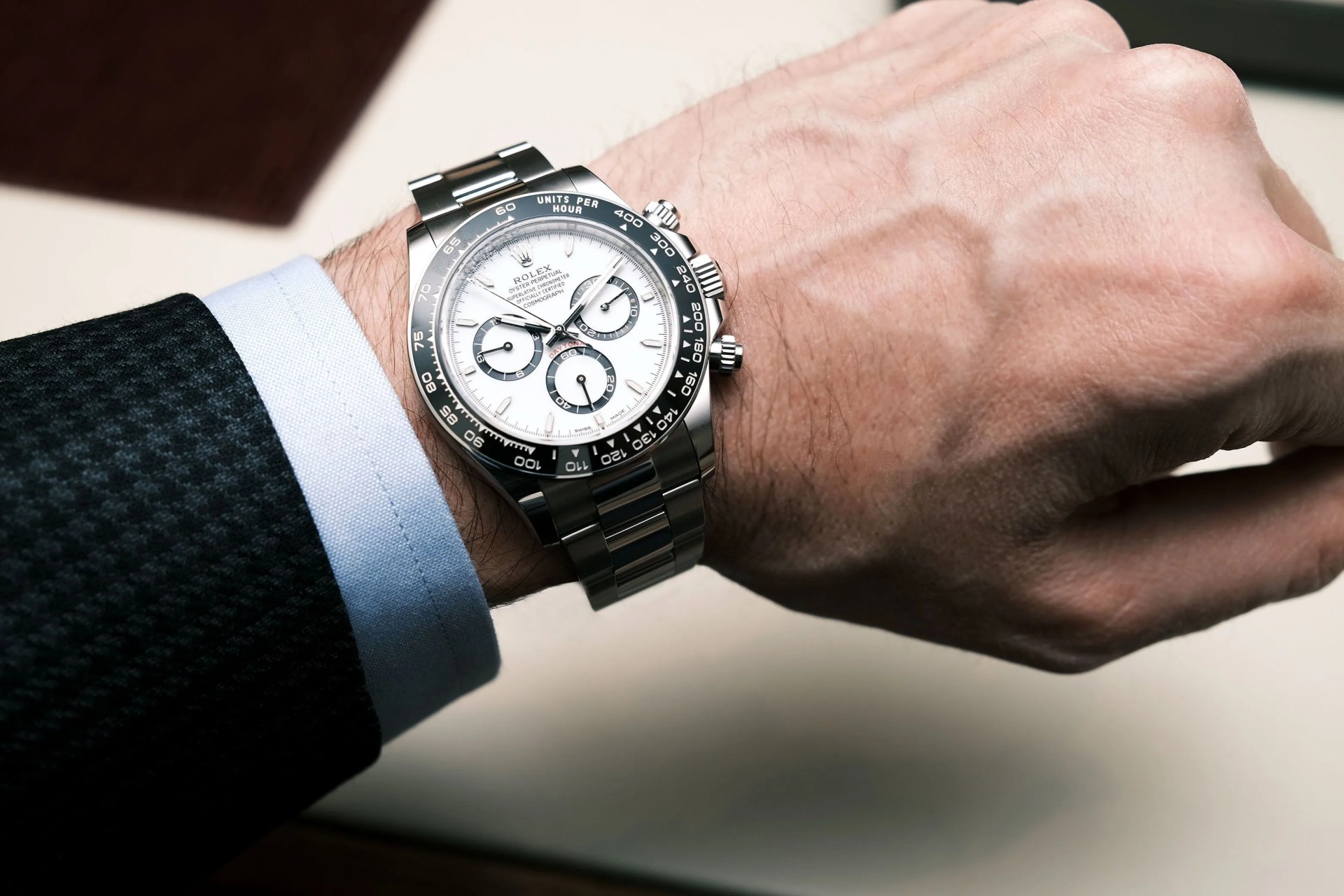 rolex daytona watch on wrist