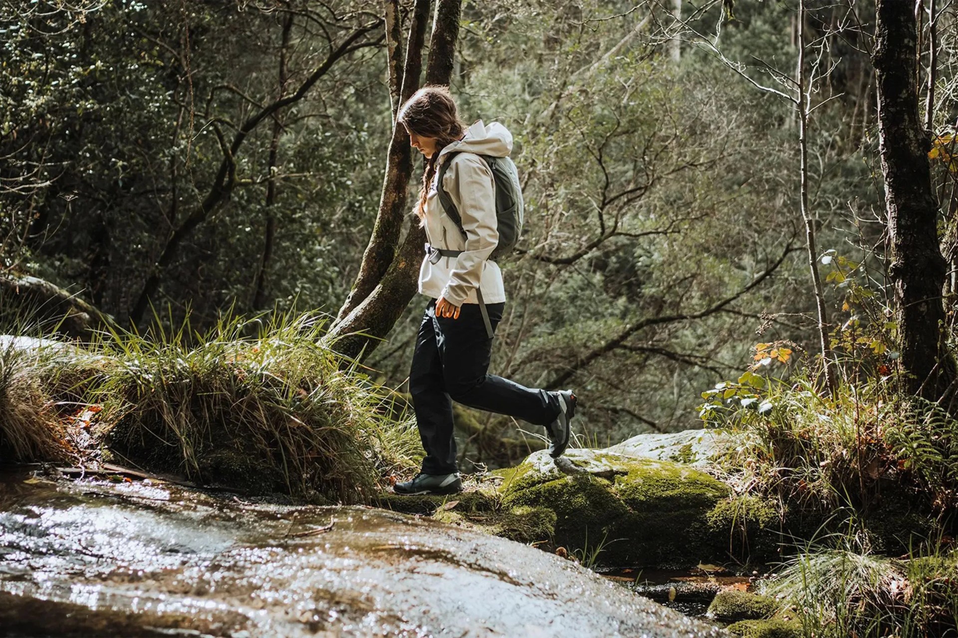 woman hiking through the woods