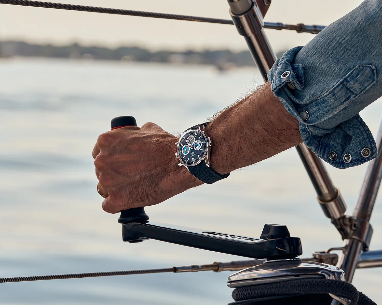 tag heuer watch worn by a man on a boat